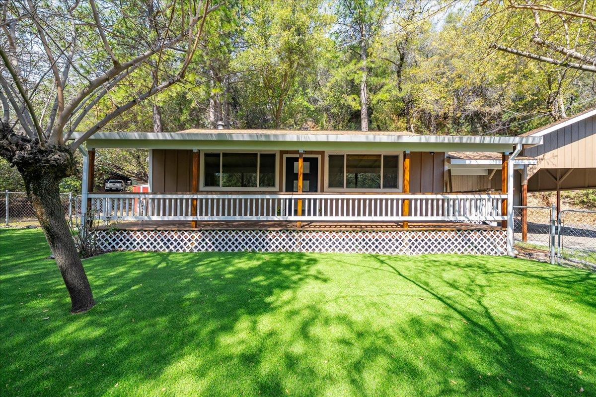 1302 Nicks Lane Placerville, CA 95667 - Photo 9 of 51 a front view of a house with a garden