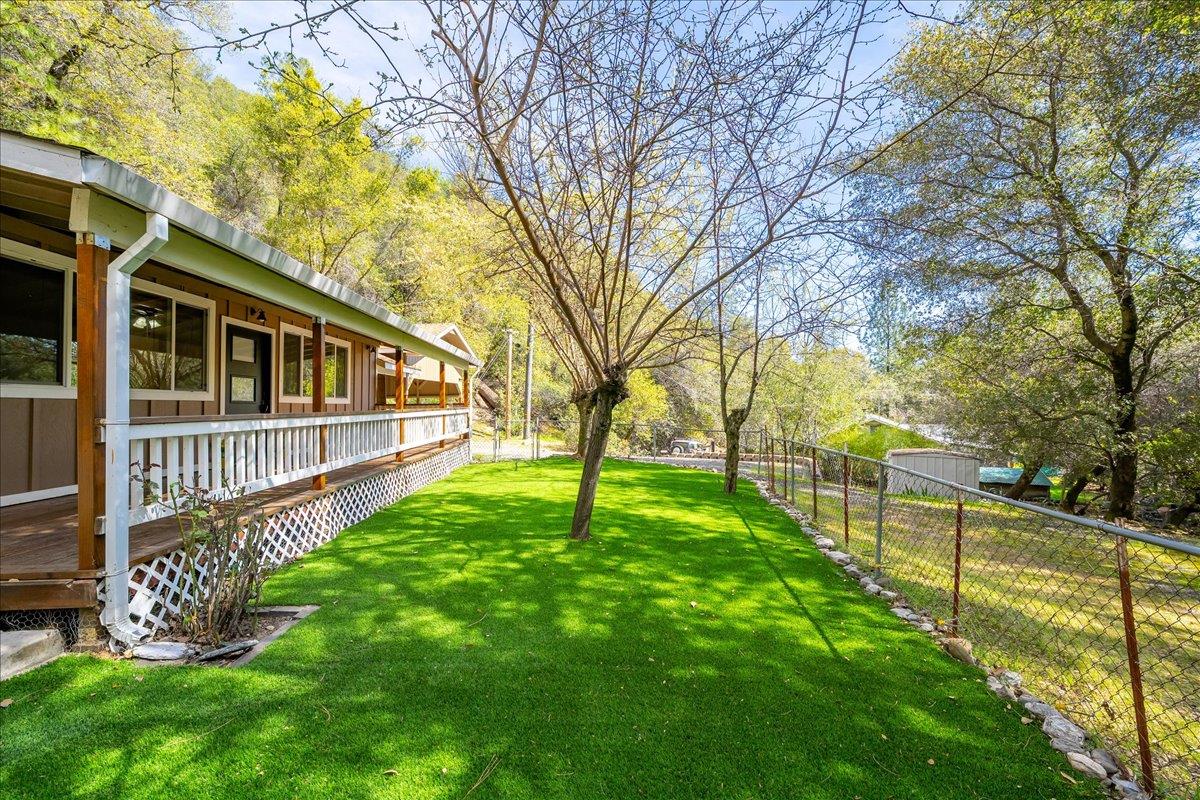 1302 Nicks Lane Placerville, CA 95667 - Photo 10 of 51 a view of a yard with large trees and a fence