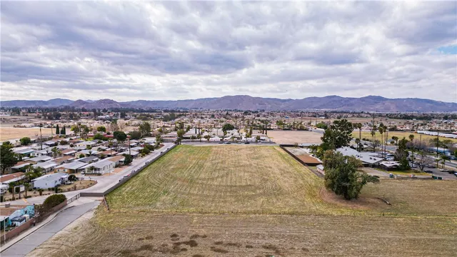 a view of a swimming pool with mountains in the background