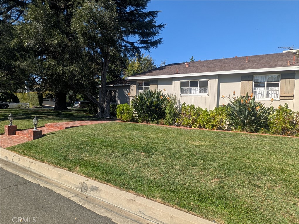 11581 Valley Spring Lane Studio City, CA 91604 - Photo 2 of 6 a front view of house with yard and green space