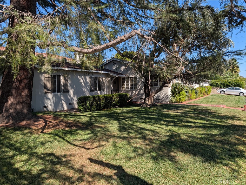 11581 Valley Spring Lane Studio City, CA 91604 - Photo 4 of 6 a view of a wooden house with a yard