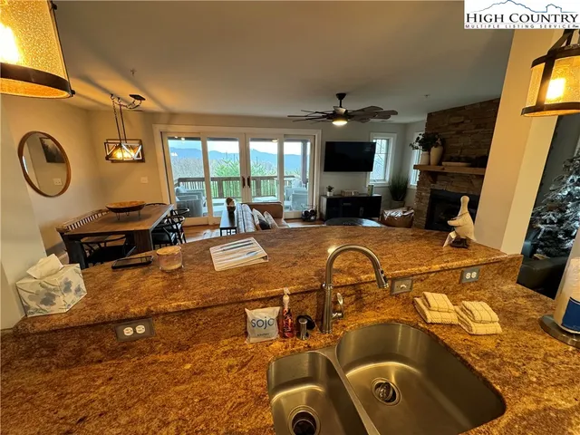 a kitchen with sink refrigerator and window
