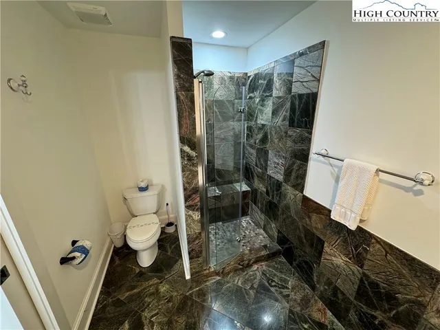 a bathroom with a double vanity sink and mirror