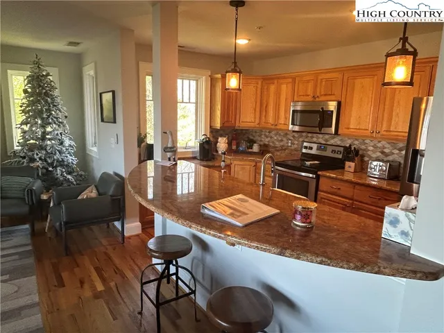 a view of a balcony with chairs