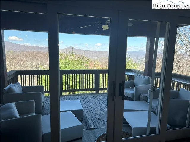 an outdoor view with a swimming pool and sitting space