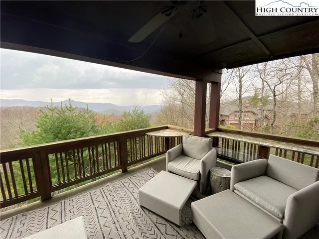a balcony with wooden floor