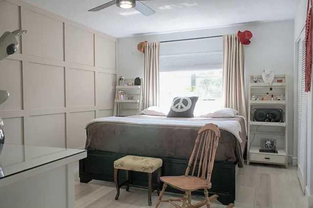 a bedroom with a bed and a window