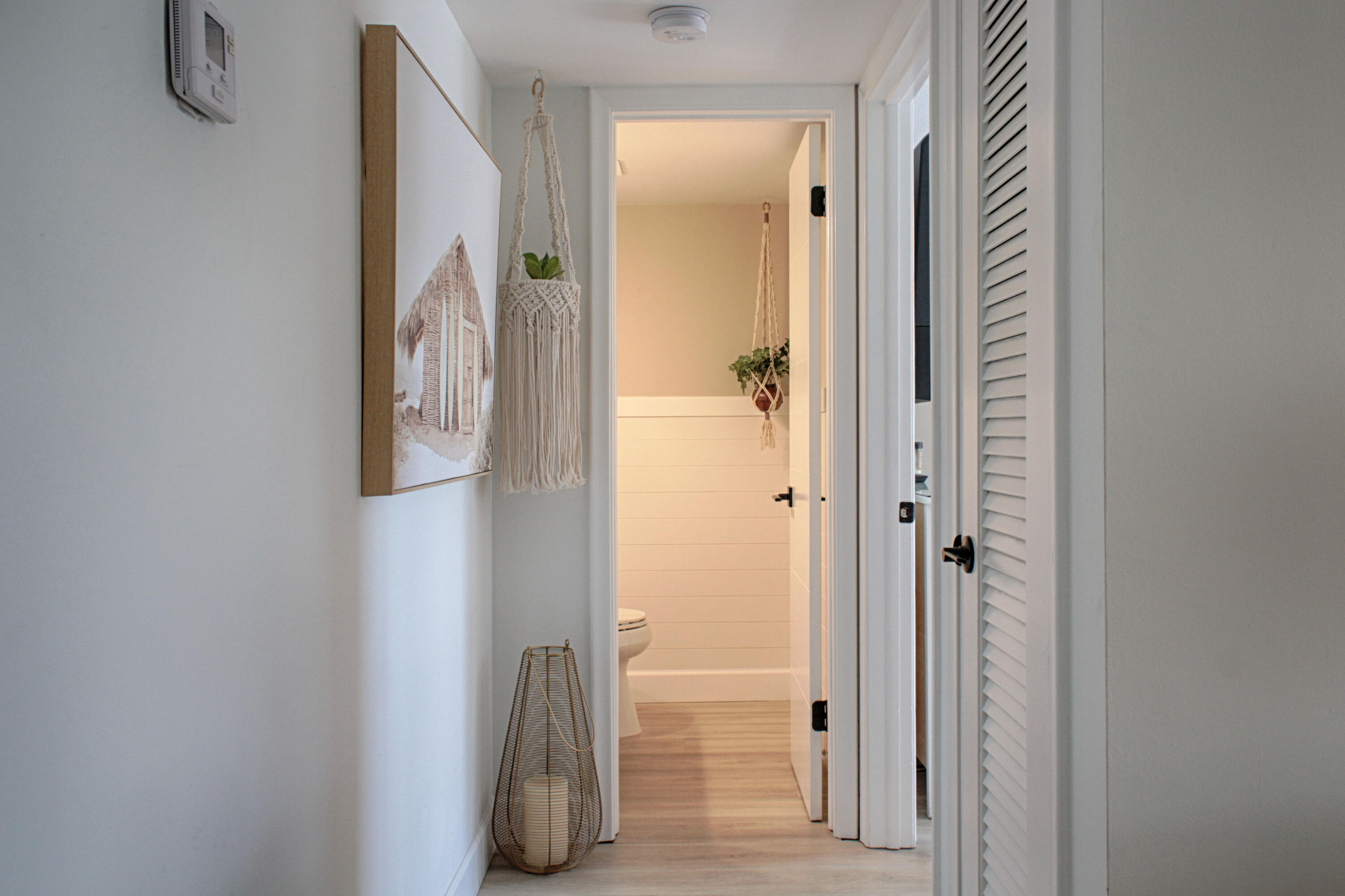2615 Northeast 1st Court, Unit 307 Boynton Beach, FL 33435 - Photo 11 of 22 a bathroom with a mirror