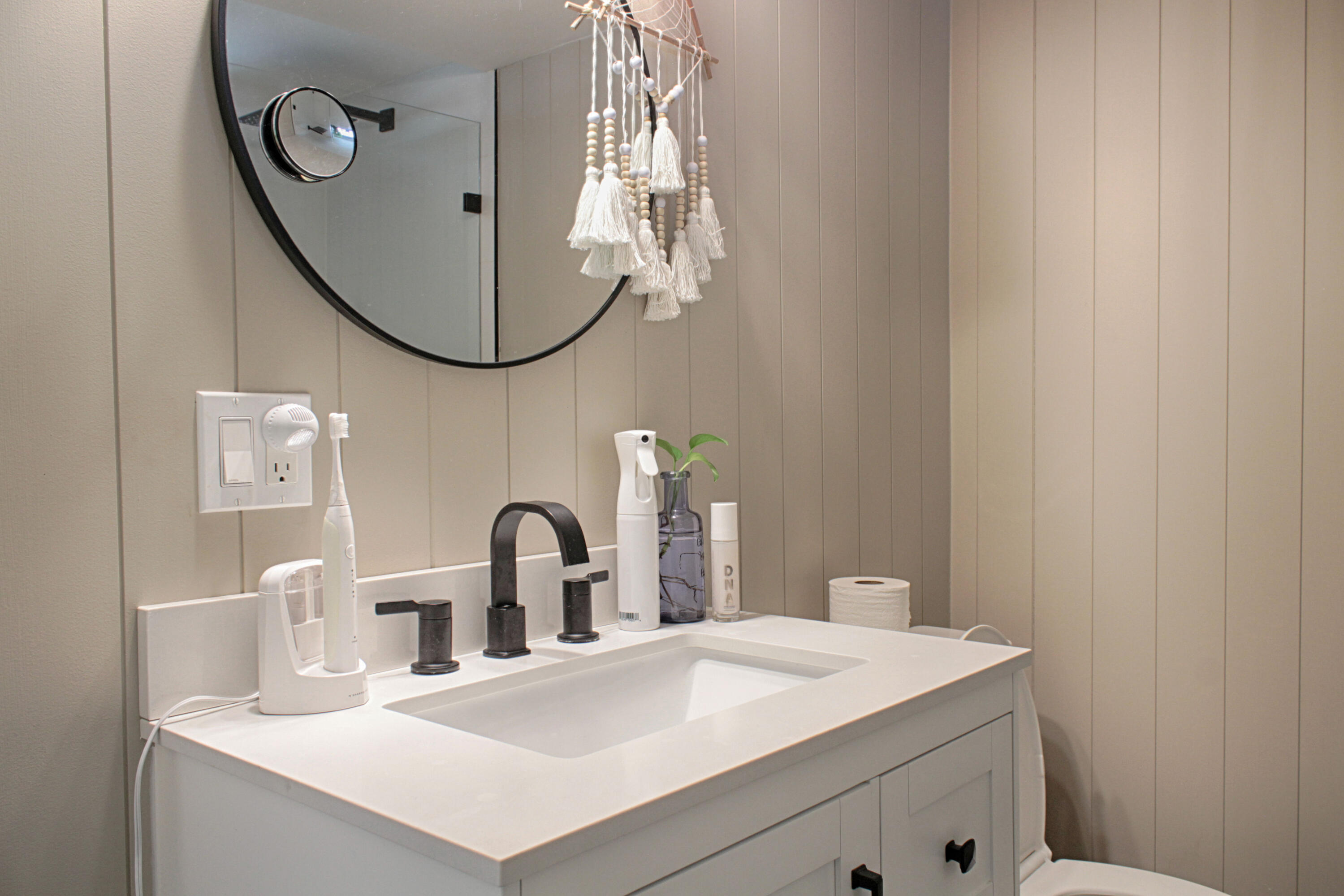 2615 Northeast 1st Court, Unit 307 Boynton Beach, FL 33435 - Photo 13 of 22 a bathroom with a sink vanity and a mirror
