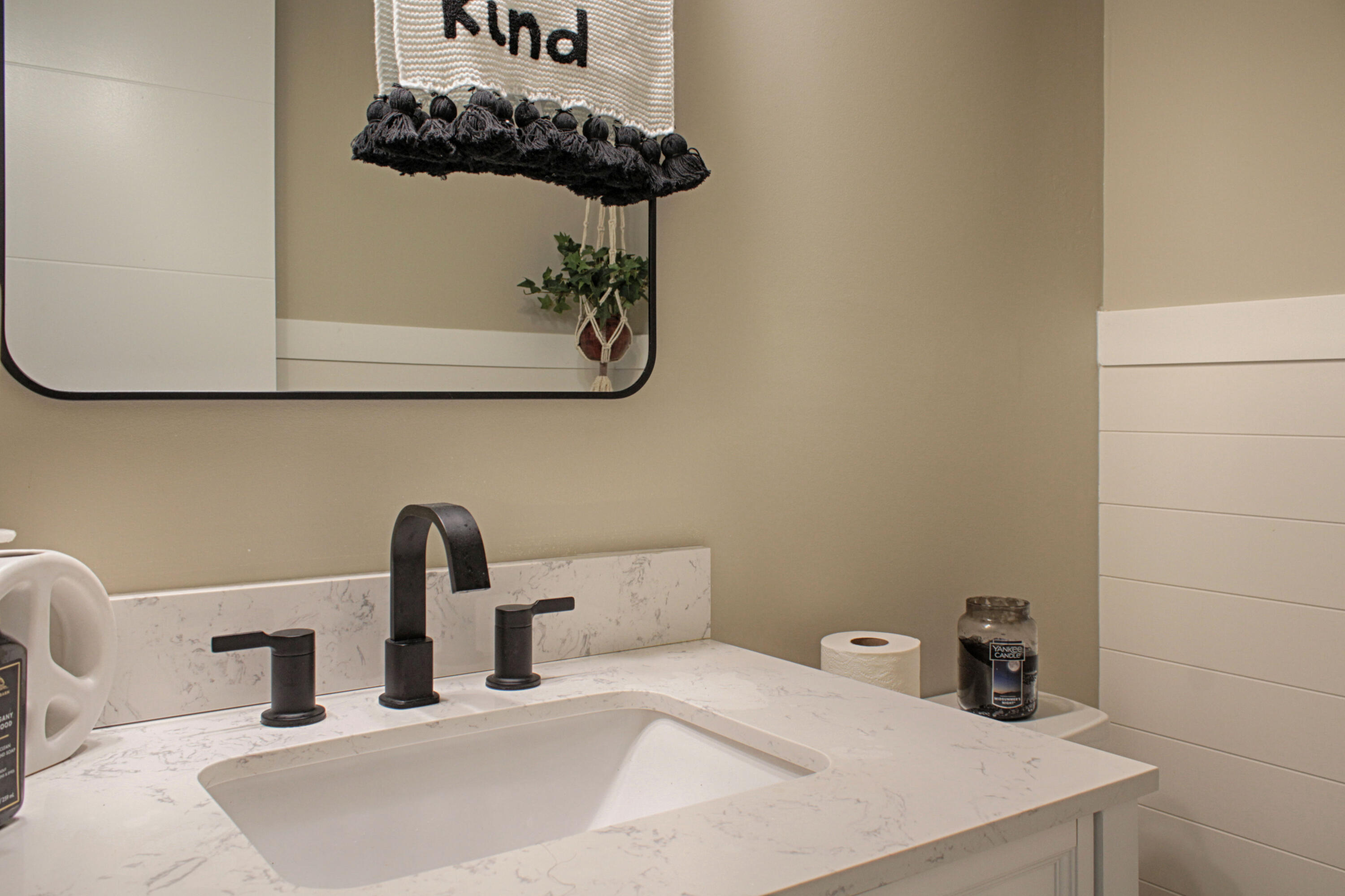 2615 Northeast 1st Court, Unit 307 Boynton Beach, FL 33435 - Photo 16 of 22 a bathroom with a sink and a mirror