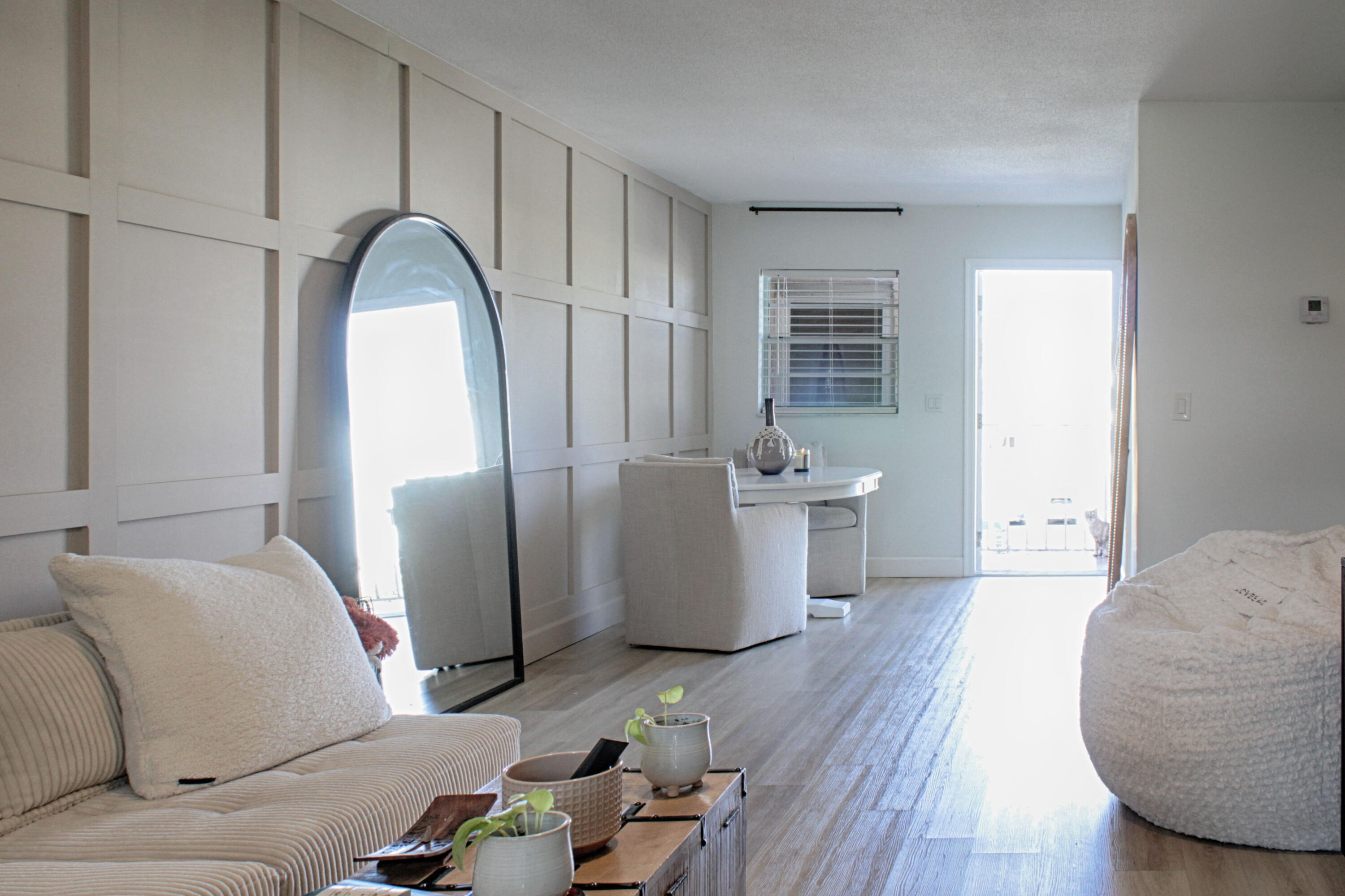 2615 Northeast 1st Court, Unit 307 Boynton Beach, FL 33435 - Photo 2 of 22 a living room with furniture and wooden floor