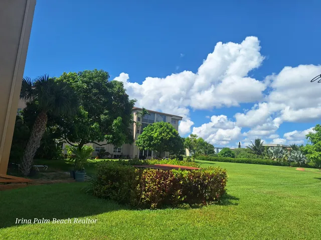 a swimming pool with outdoor seating and yard