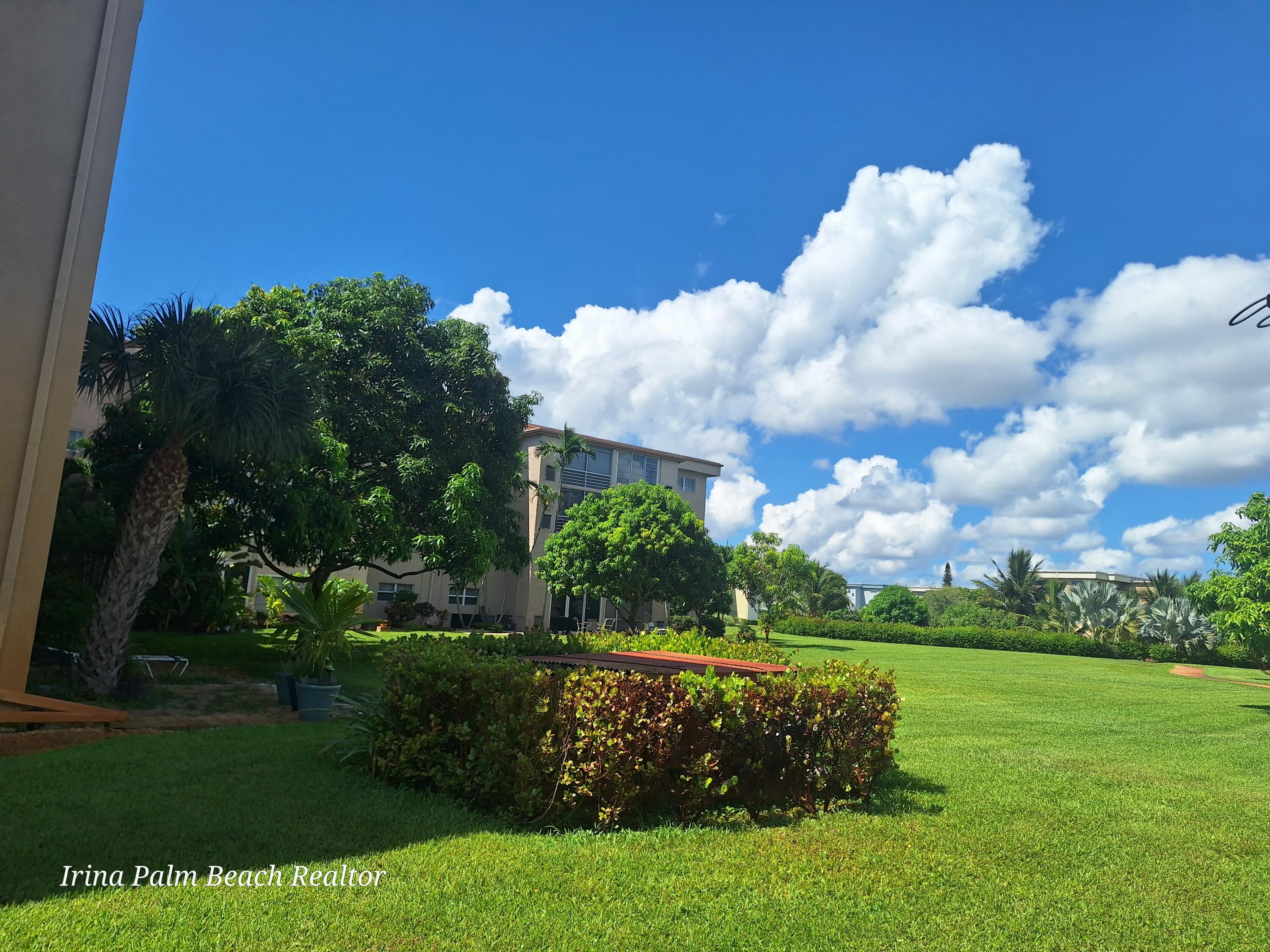 2615 Northeast 1st Court, Unit 307 Boynton Beach, FL 33435 - Photo 21 of 22 a view of a golf course with a lake