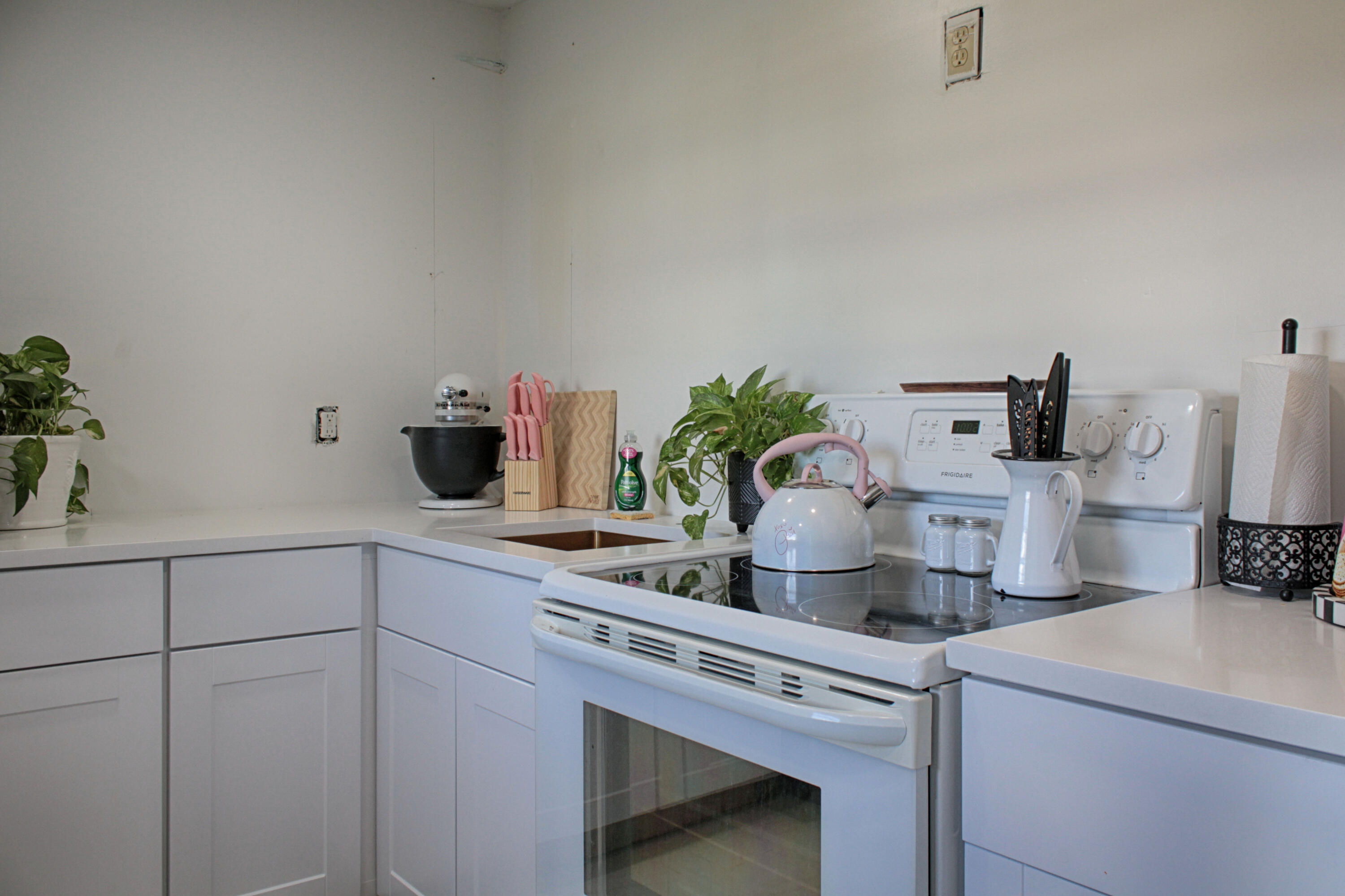 2615 Northeast 1st Court, Unit 307 Boynton Beach, FL 33435 - Photo 3 of 22 a kitchen with a sink and cabinets