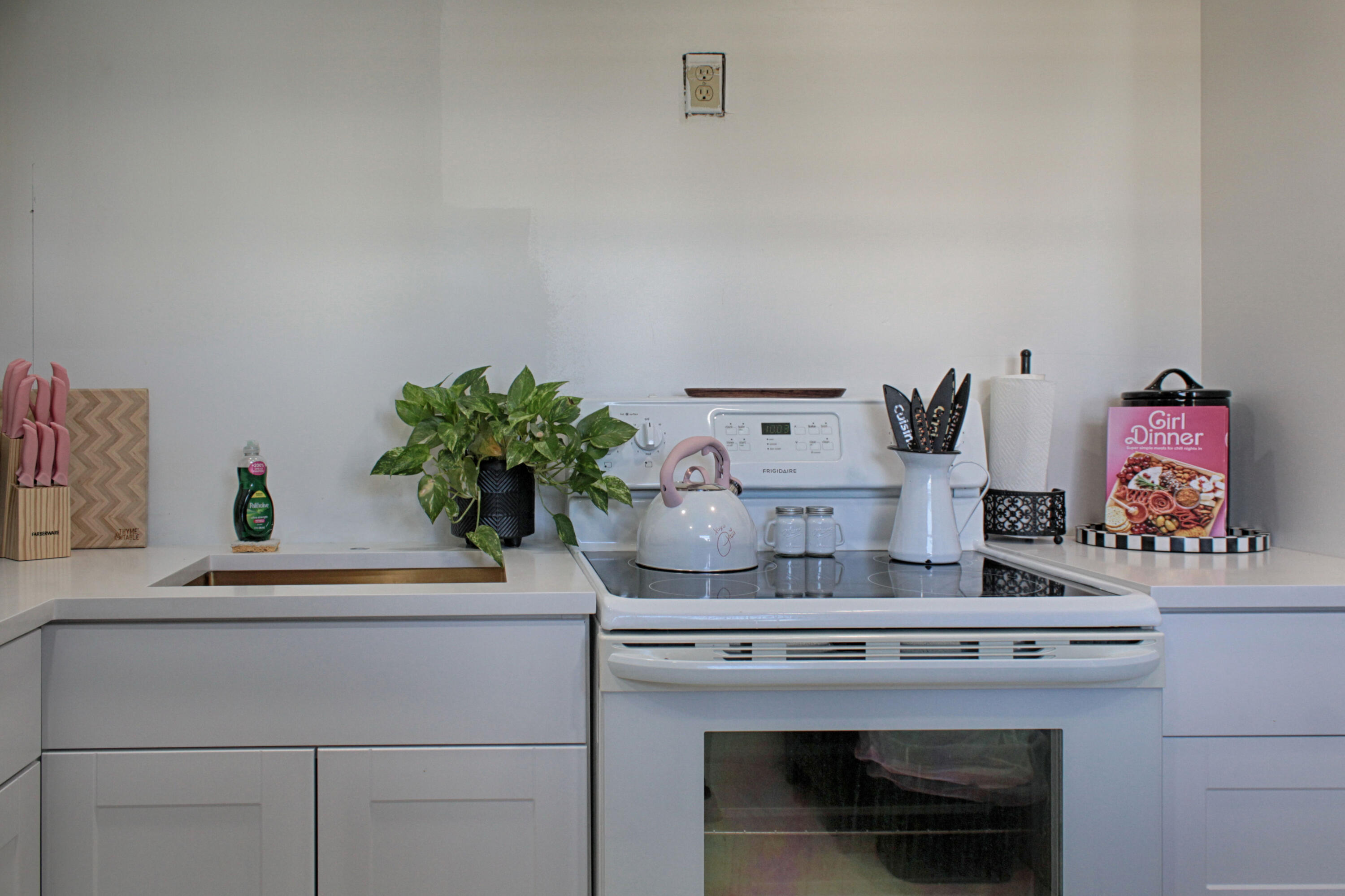 2615 Northeast 1st Court, Unit 307 Boynton Beach, FL 33435 - Photo 5 of 22 a kitchen with a stove and cabinets