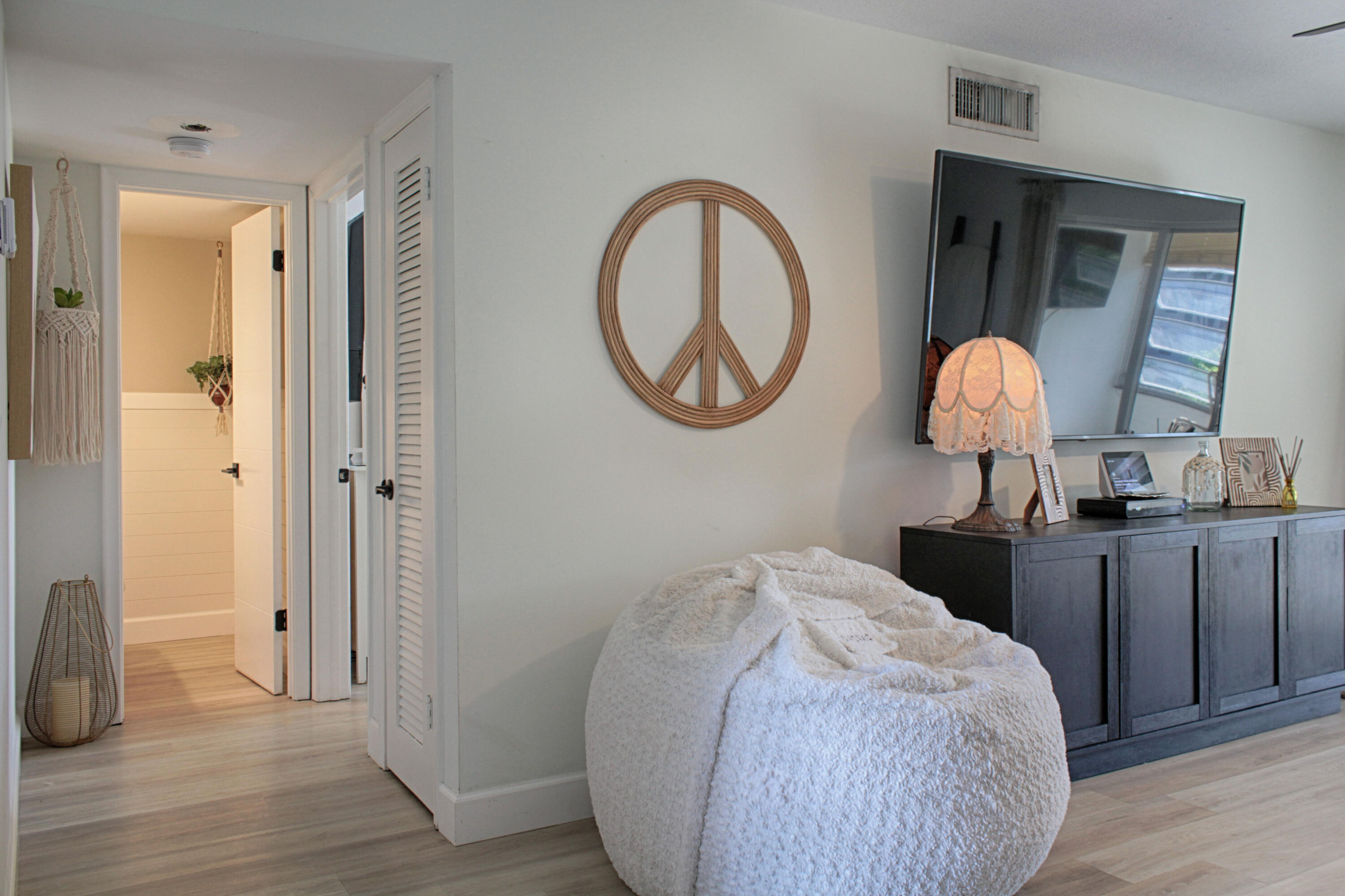 2615 Northeast 1st Court, Unit 307 Boynton Beach, FL 33435 - Photo 8 of 22 a bedroom with a bed and a mirror