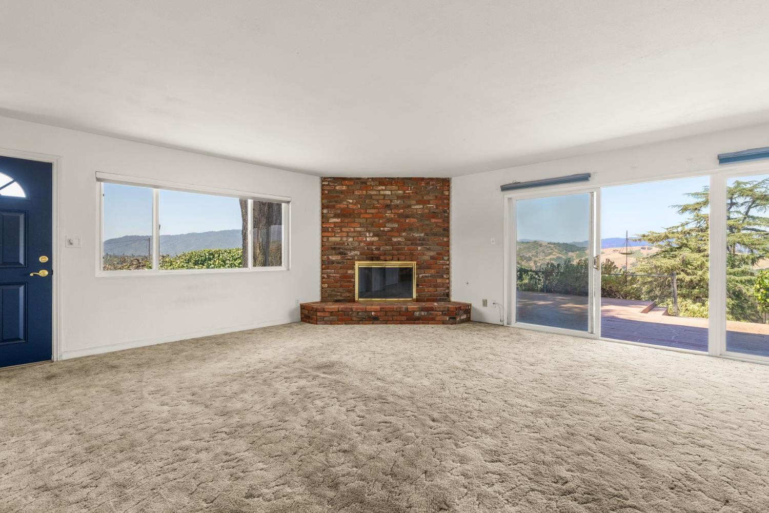 25 Hill Street Oak View, CA 93022 - Photo 4 of 16 an empty room with windows and fireplace