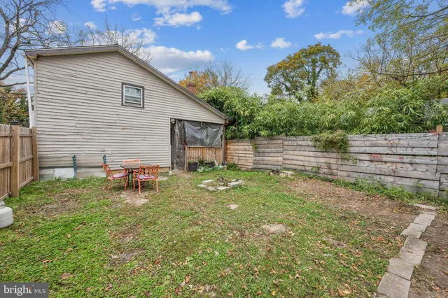 a view of backyard with a garden and entertaining space