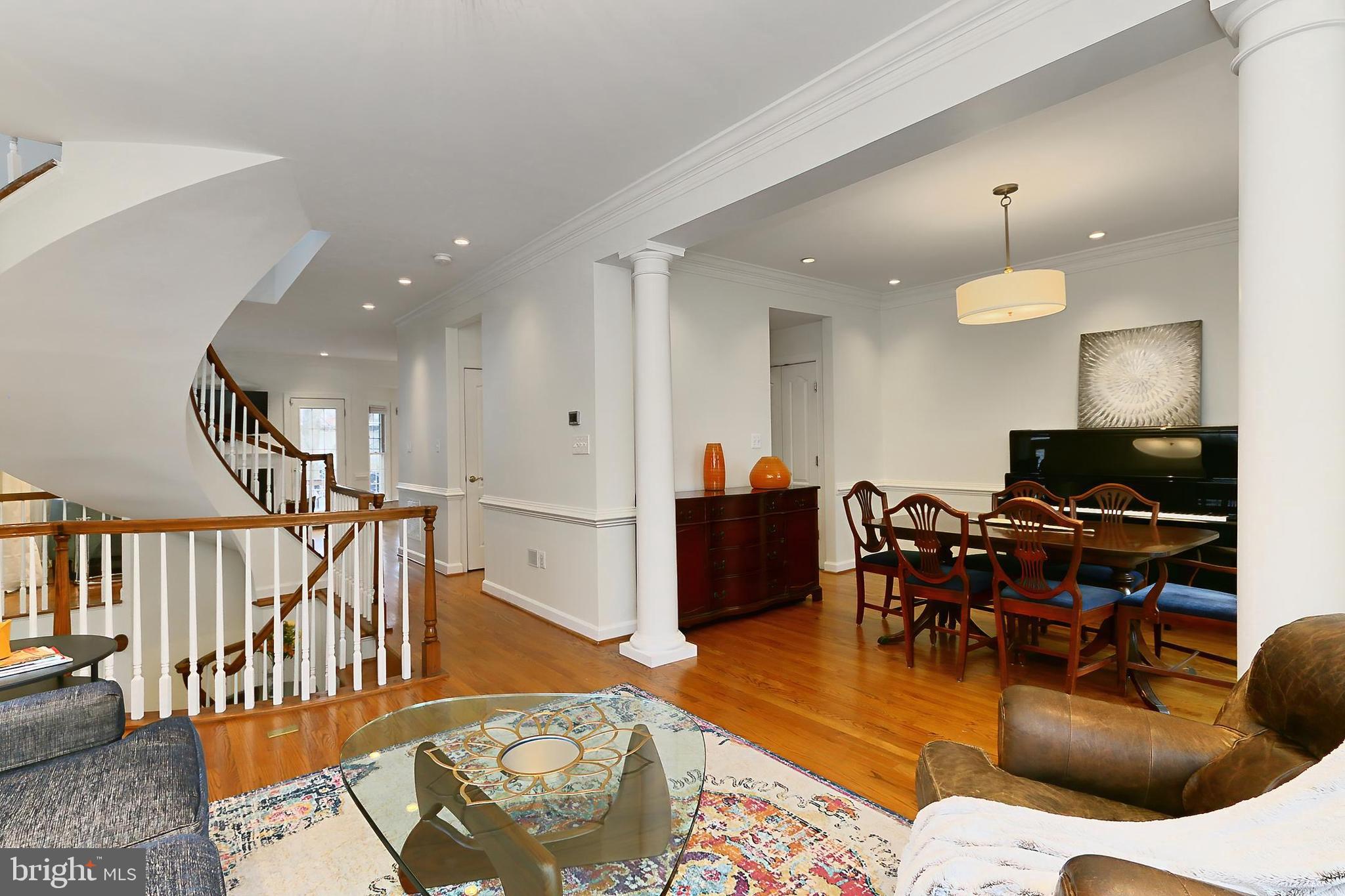 132 Rees Place Falls Church, VA 22046 - Photo 12 of 66 a living room with furniture kitchen view and a wooden floor