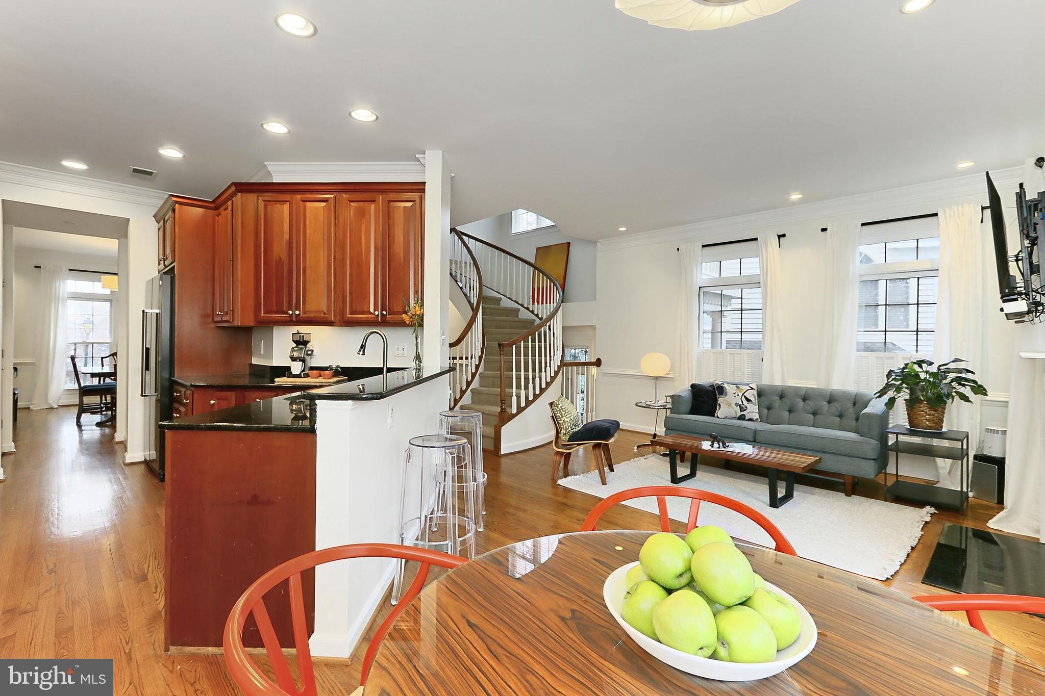 132 Rees Place Falls Church, VA 22046 - Photo 21 of 66 a living room with furniture a wooden floor and a fireplace