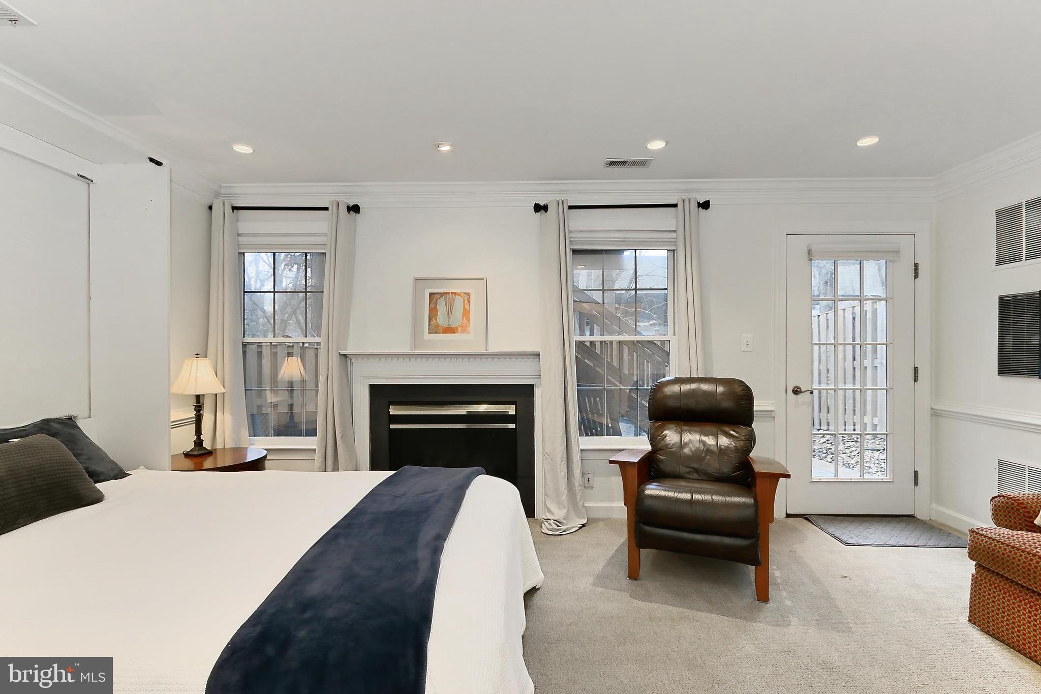 132 Rees Place Falls Church, VA 22046 - Photo 45 of 66 a bedroom with furniture and a fireplace