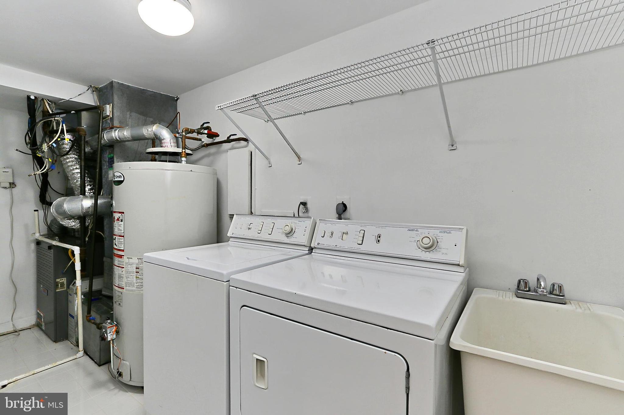 132 Rees Place Falls Church, VA 22046 - Photo 47 of 66 a utility room with dryer and washer