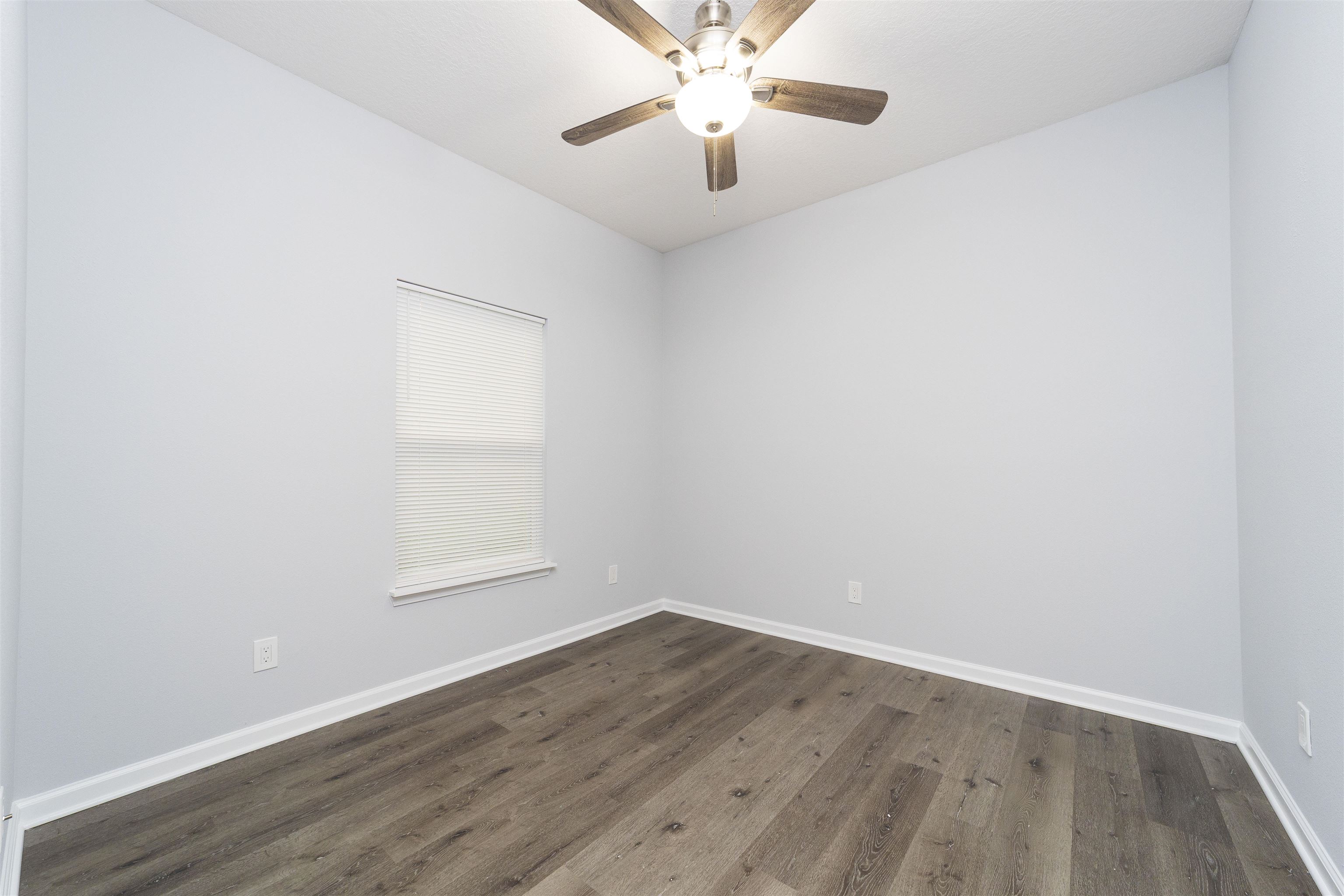 679 Coral Circle St. Augustine, FL 32080 - Photo 26 of 48 an empty room with wooden floor and windows