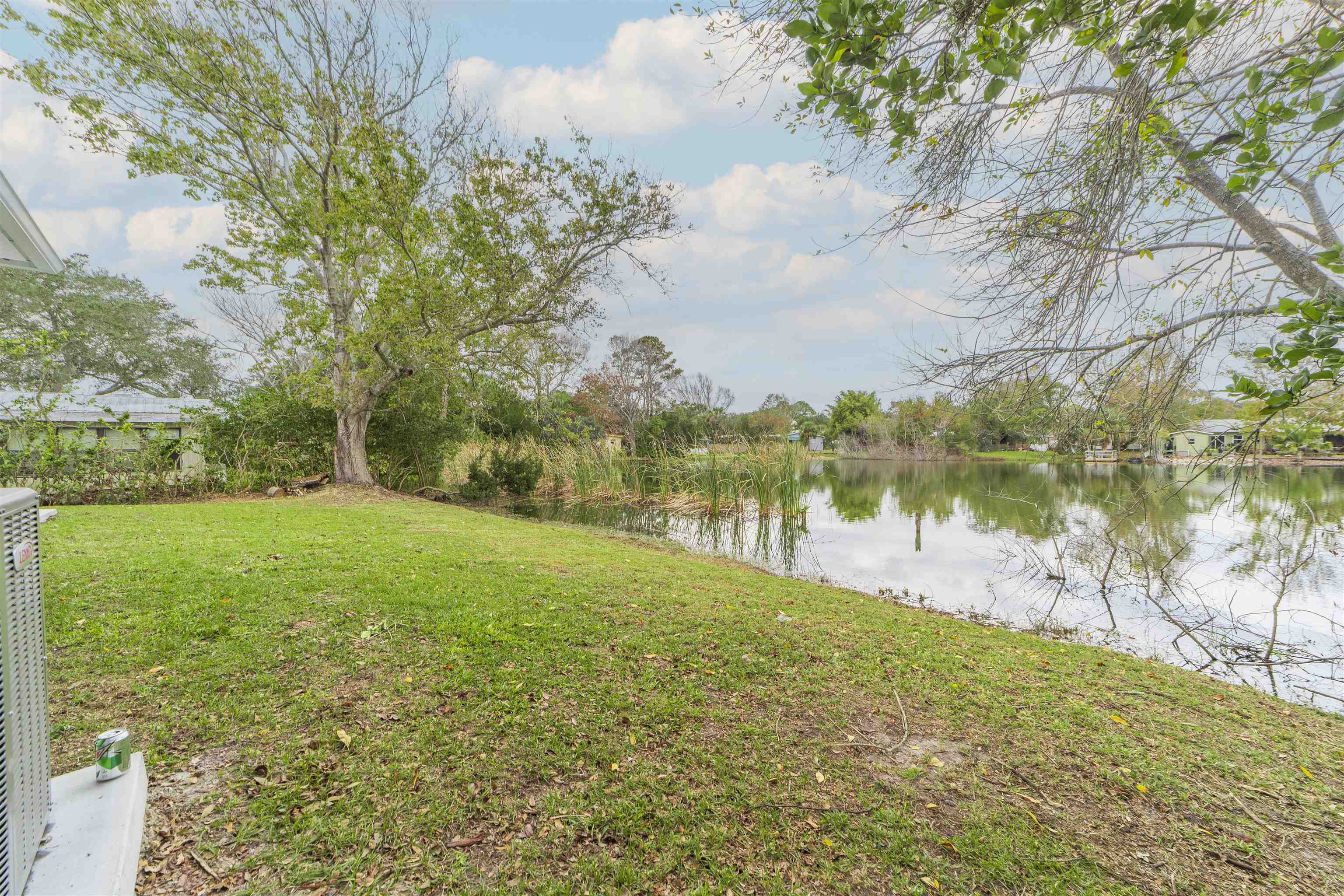 679 Coral Circle St. Augustine, FL 32080 - Photo 3 of 48 a view of a lake from a yard