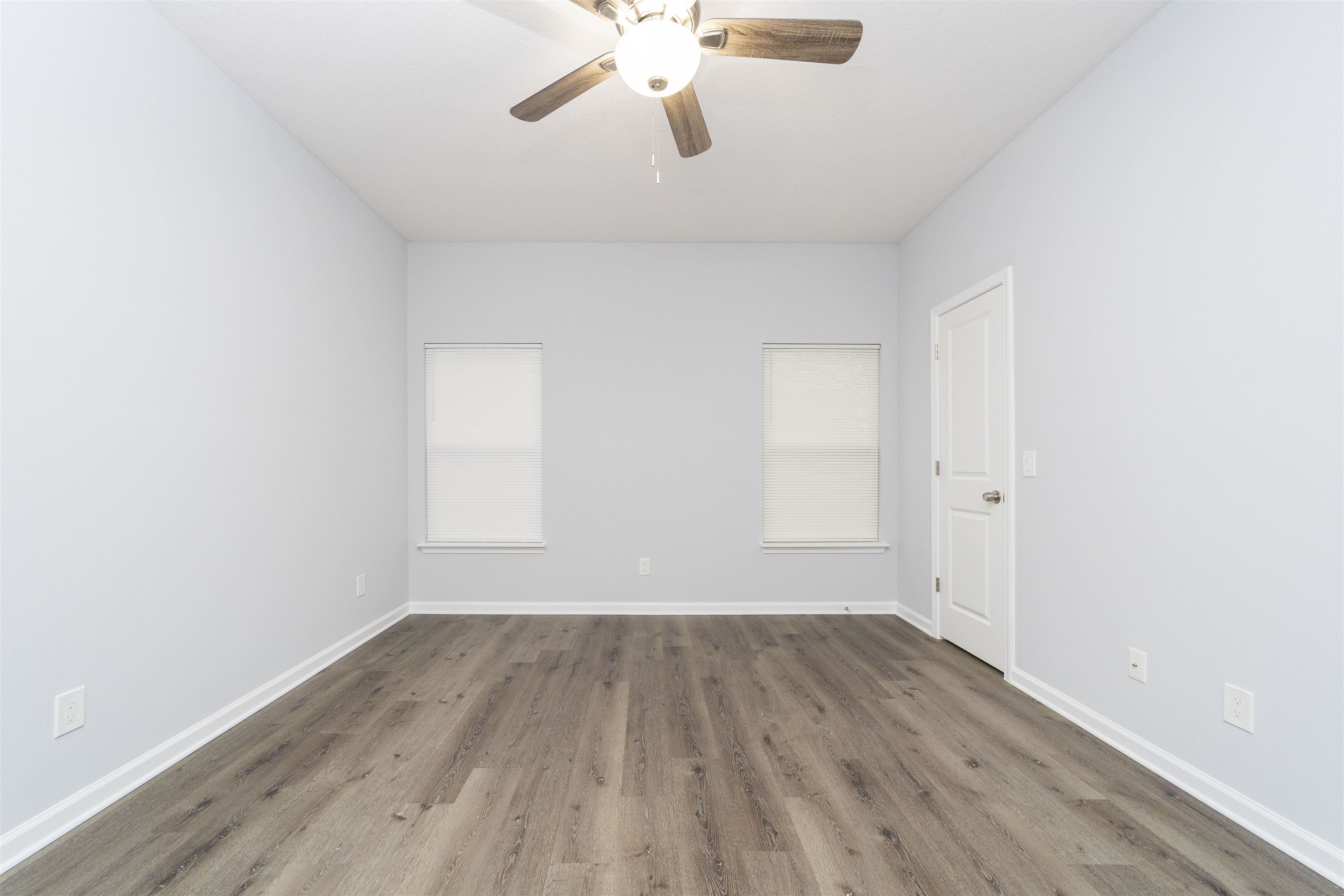 679 Coral Circle St. Augustine, FL 32080 - Photo 47 of 48 wooden floor in an empty room with a window