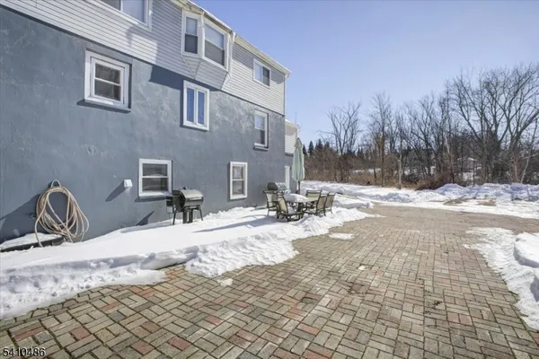 a view of a dinning table and chairs in the patio
