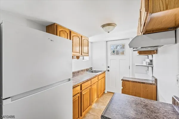 a bathroom with a sink a mirror and a bathtub