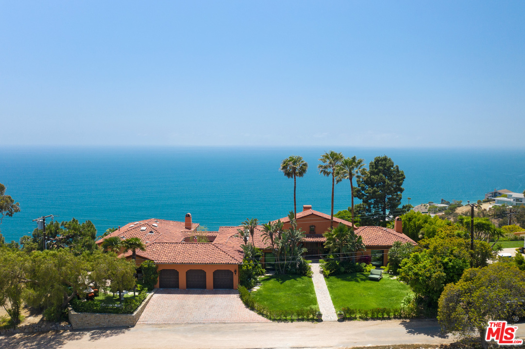 an aerial view of a house with a garden