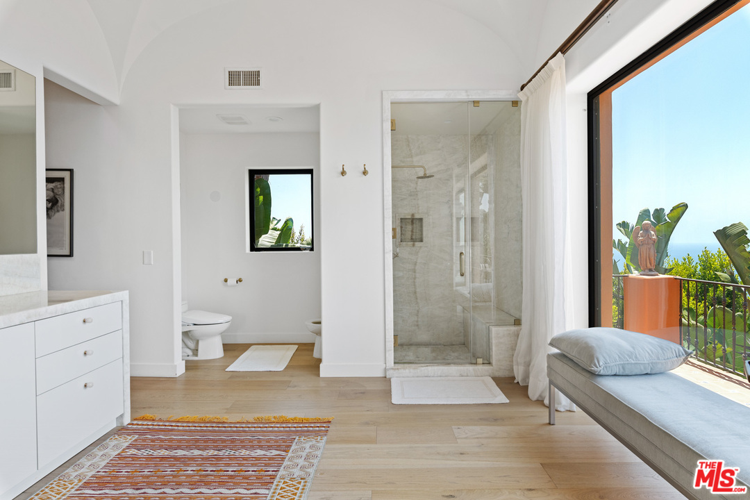 21424 Deerpath Lane Malibu, CA 90265 - Photo 29 of 51 a spacious bathroom with double vanity and a shower
