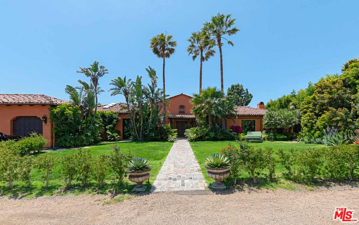 21424 Deerpath Lane Malibu, CA 90265 - Photo 5 of 51 a front view of a house with garden