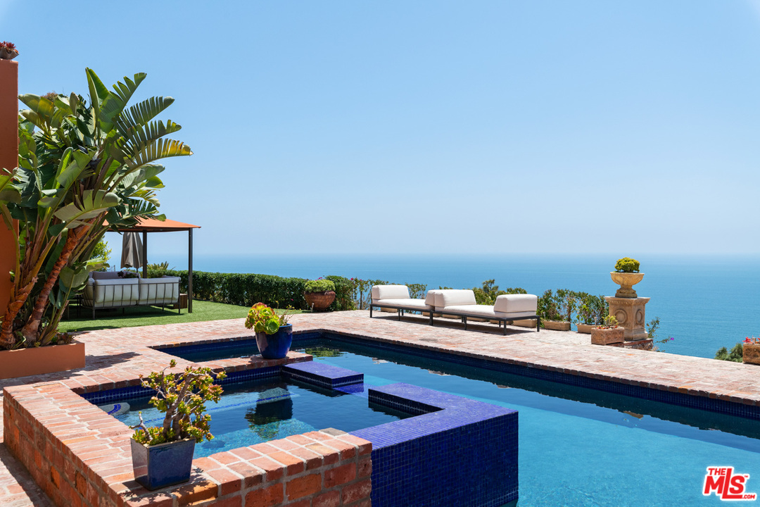 21424 Deerpath Lane Malibu, CA 90265 - Photo 44 of 51 a reading room with furniture and a potted plant