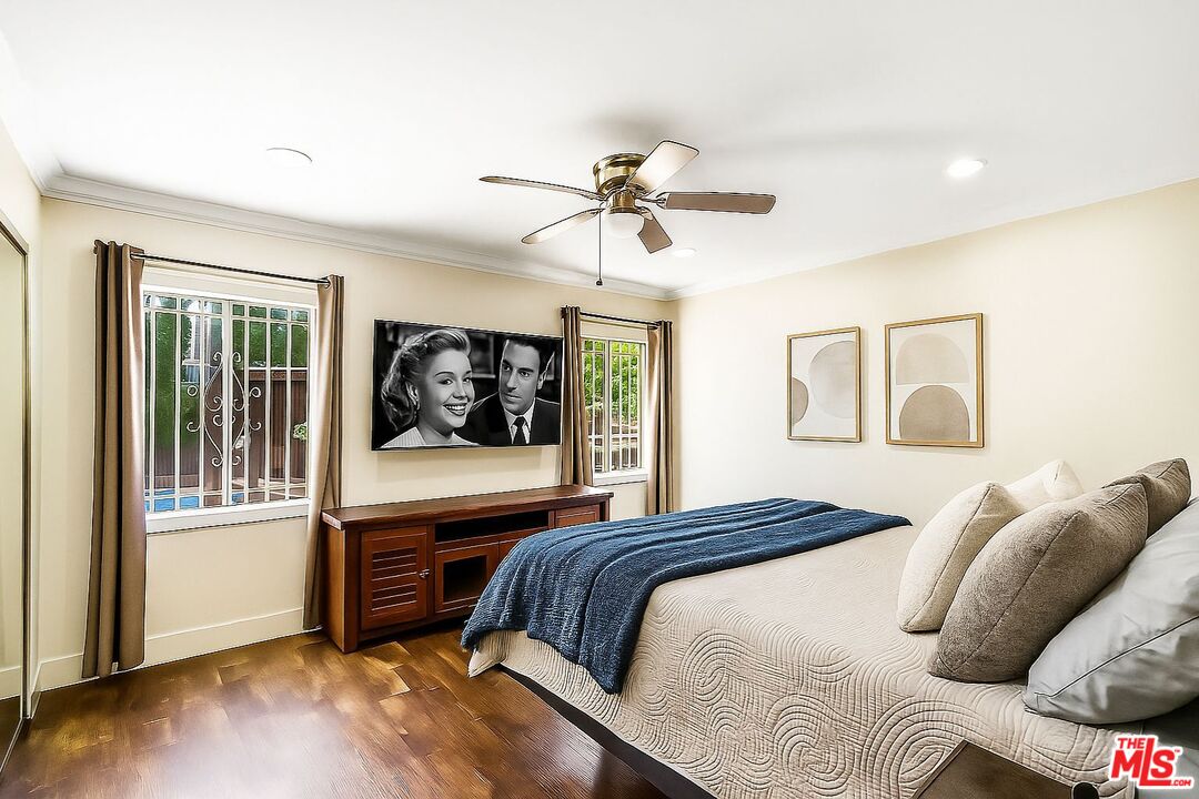 5342 Lemon Grove Avenue Los Angeles, CA 90038 - Photo 11 of 30 a bedroom with a bed and a window