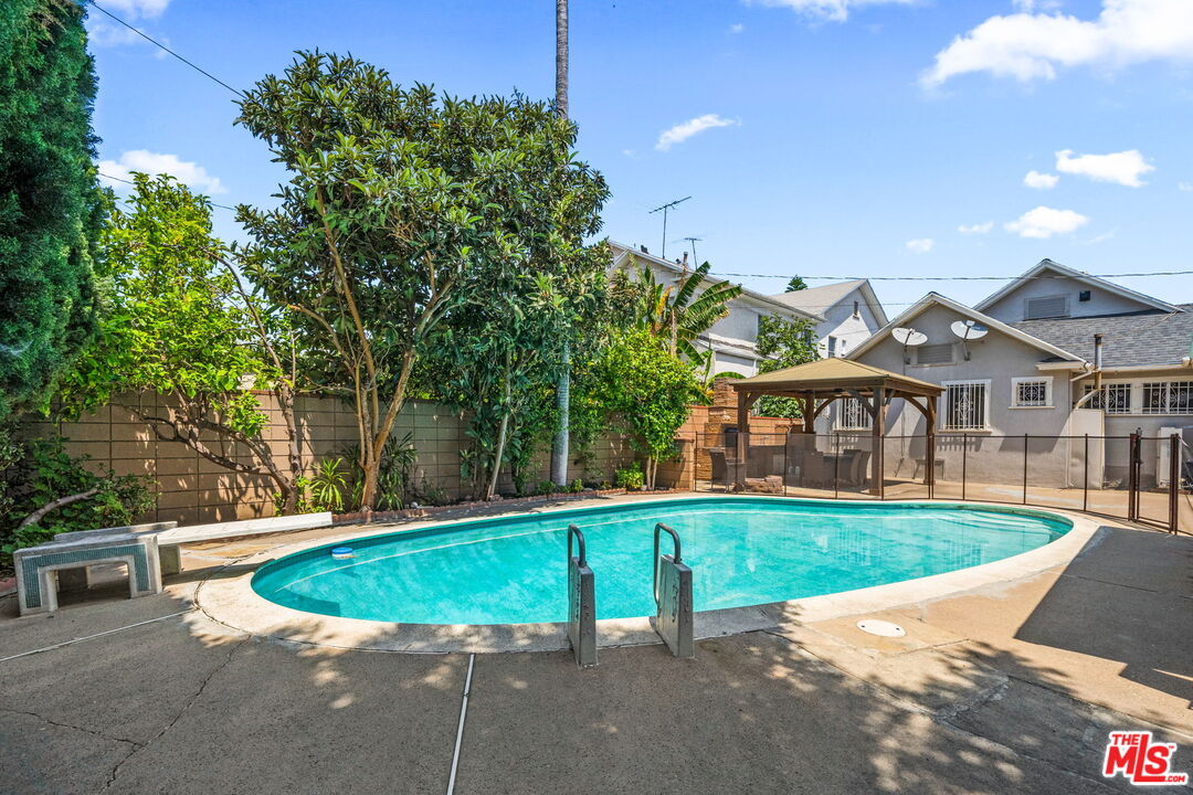 5342 Lemon Grove Avenue Los Angeles, CA 90038 - Photo 19 of 30 a view of a house with a yard and sitting area