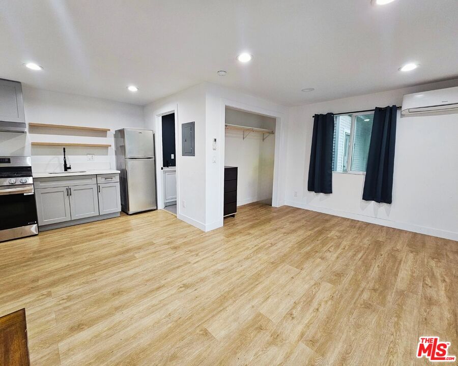 5342 Lemon Grove Avenue Los Angeles, CA 90038 - Photo 26 of 30 a view of an empty room with a kitchen