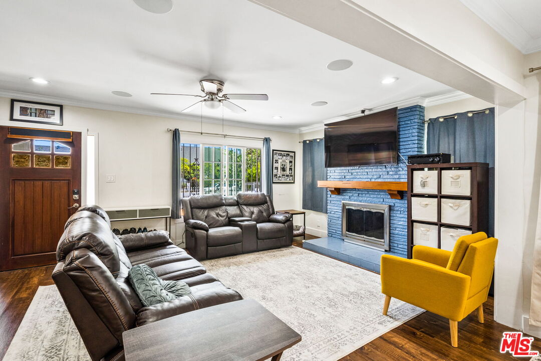 5342 Lemon Grove Avenue Los Angeles, CA 90038 - Photo 6 of 30 a living room with furniture fireplace and flat screen tv