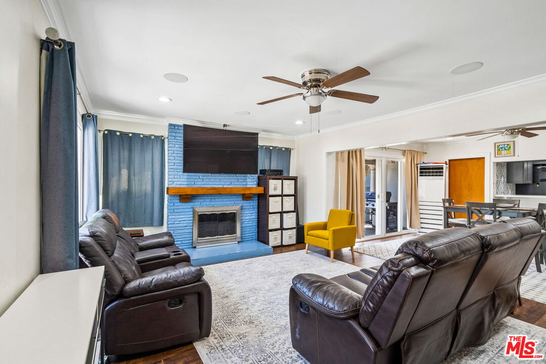 5342 Lemon Grove Avenue Los Angeles, CA 90038 - Photo 7 of 30 a living room with furniture fireplace and a flat screen tv
