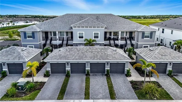 an aerial view of a house with swimming pool outdoor seating area