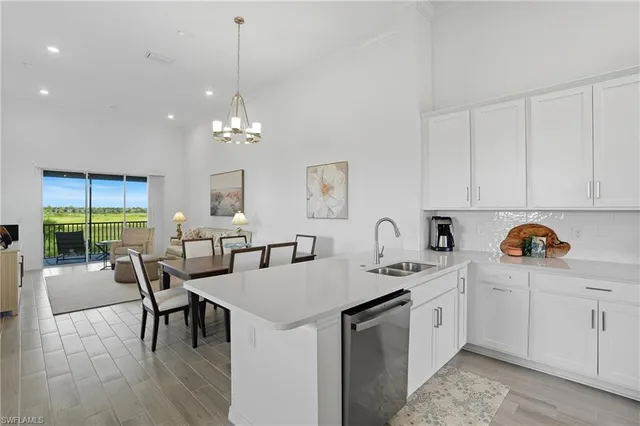 a kitchen that has a table chairs and a stove