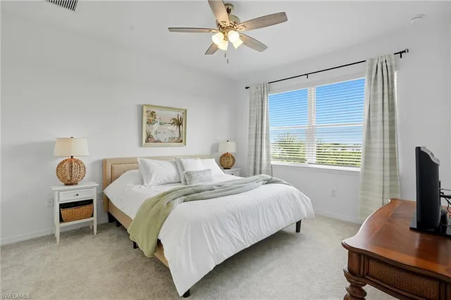 a bedroom with a bed and a desk