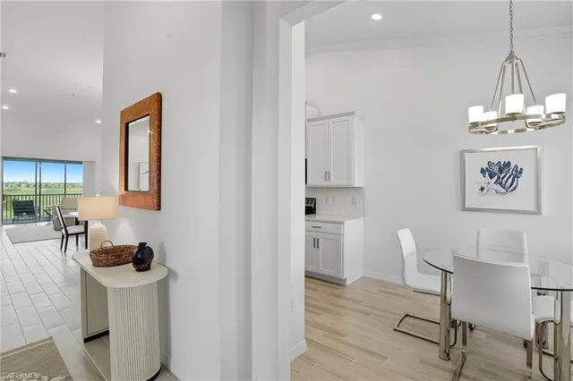 a view of a room with breakfast area and windows