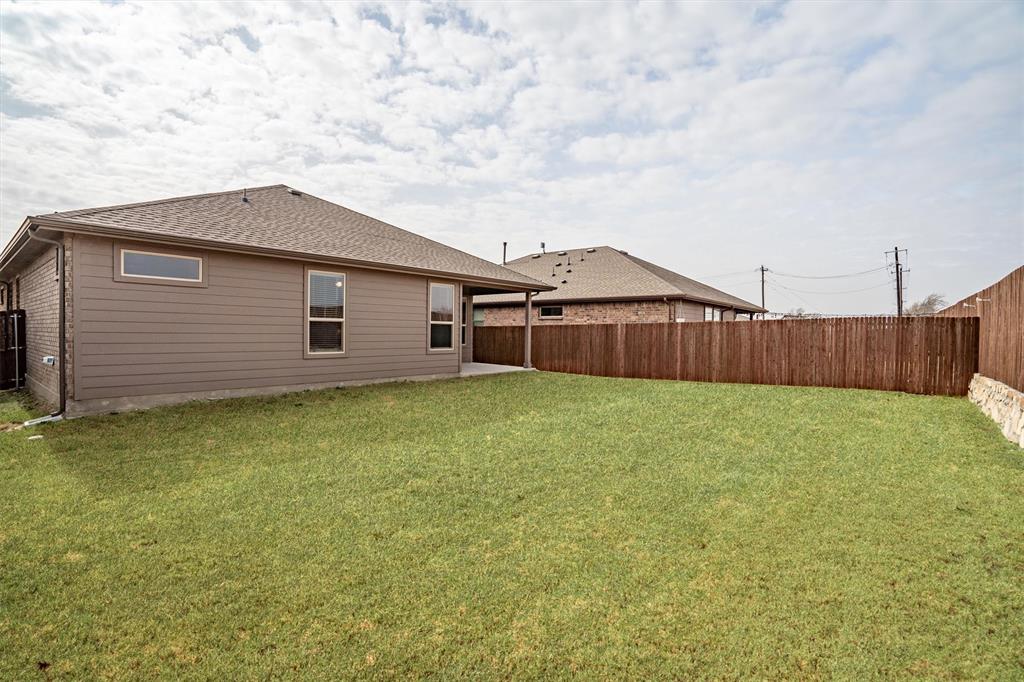 1864 Mensa Drive Haslet, TX 76052 - Photo 36 of 40 a front view of a house with a garden