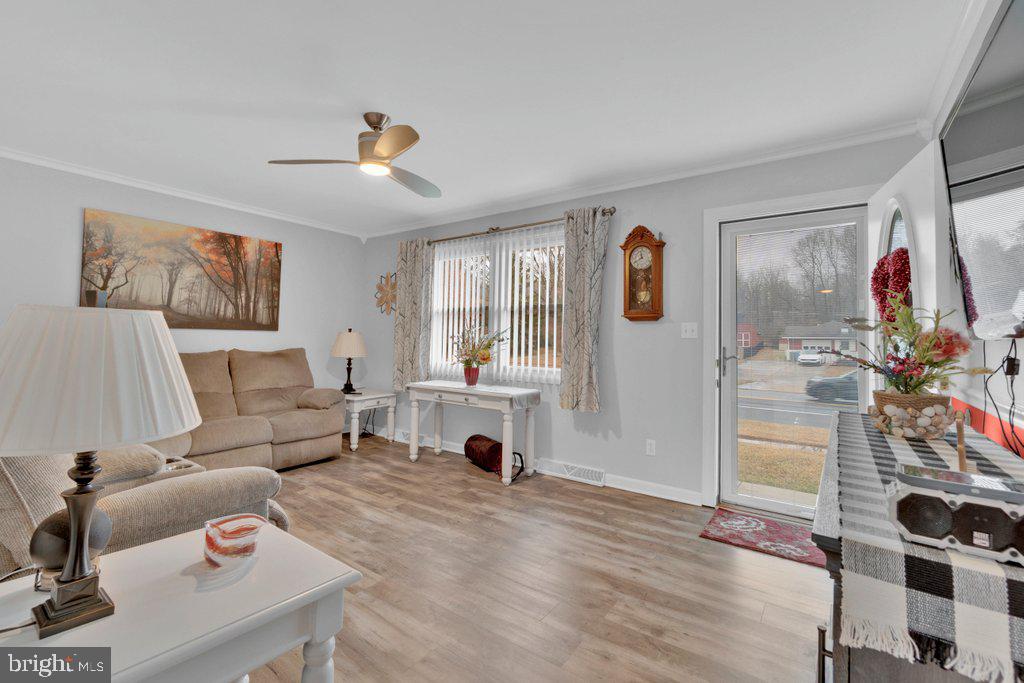 714 Joppa Farm Road Joppa, MD 21085 - Photo 12 of 46 a living room with furniture and a flat screen tv