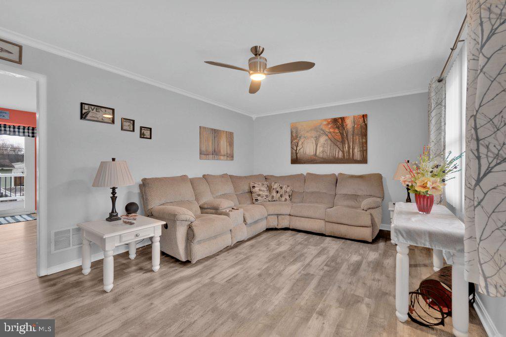 714 Joppa Farm Road Joppa, MD 21085 - Photo 13 of 46 a living room with furniture and a wooden floor