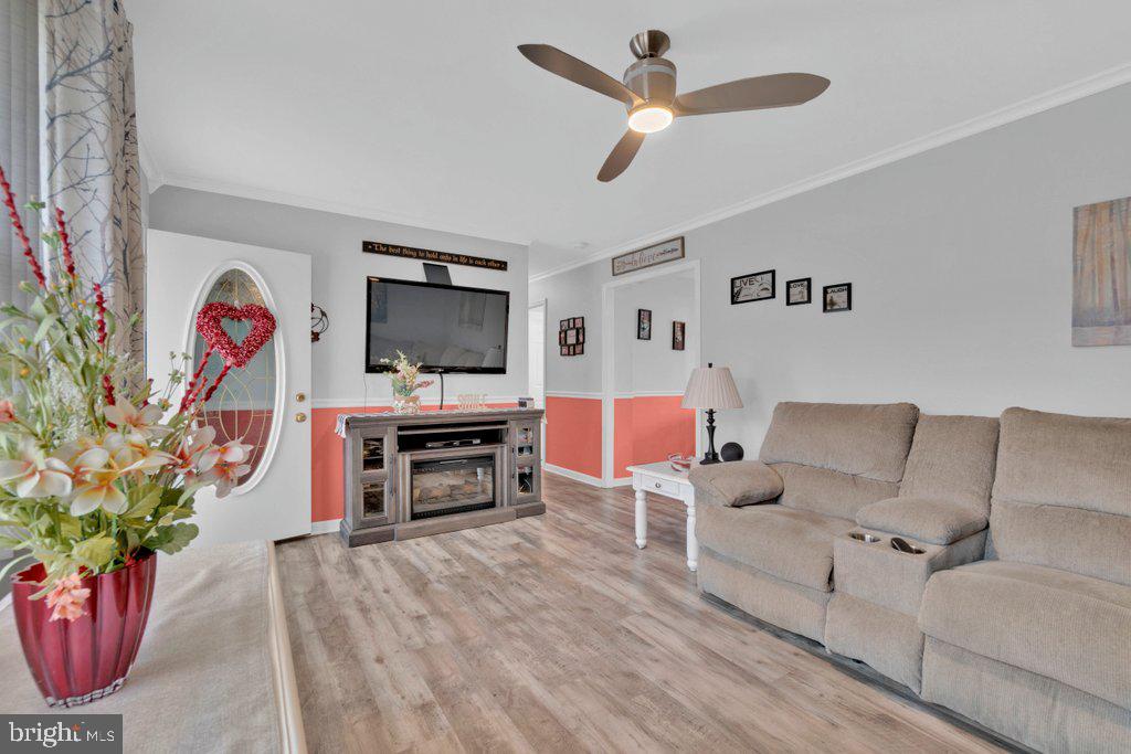 714 Joppa Farm Road Joppa, MD 21085 - Photo 14 of 46 a living room with furniture and a flat screen tv