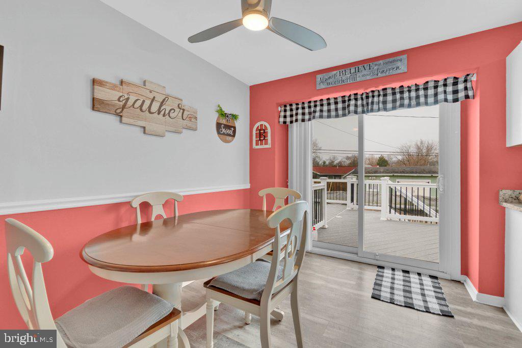 714 Joppa Farm Road Joppa, MD 21085 - Photo 17 of 46 a dining room with furniture and a floor to ceiling window