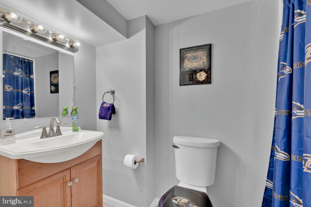 714 Joppa Farm Road Joppa, MD 21085 - Photo 44 of 46 a bathroom with a sink mirror and toilet